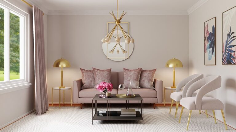 A bright living room with a sofa, two chairs, a coffee table, and an area rug arranged for easy conversation.