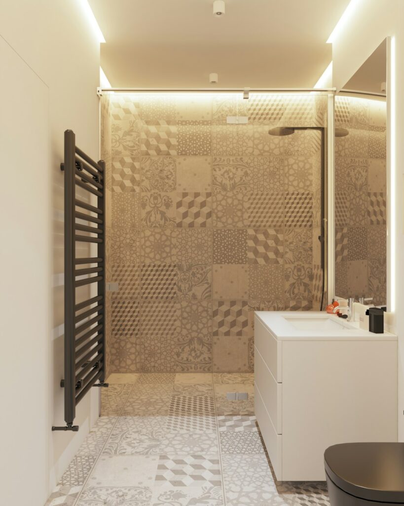 Bright compact bathroom with a floating vanity, large mirror, pale tile, and organized storage.
